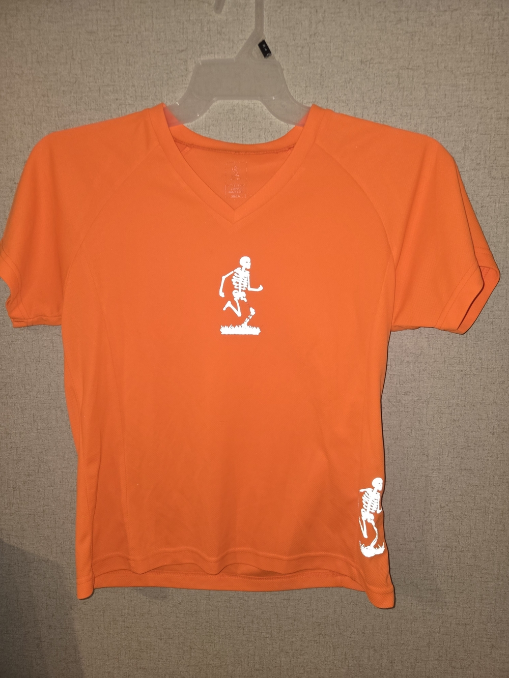 2Womens Orange V-Neck Short Sleeve Tee with Skeleton Graphic Medium